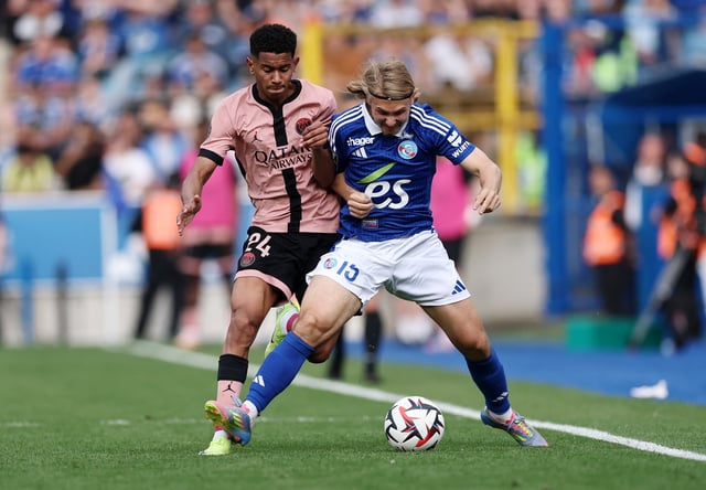 Soccer Football - Ligue 1 - RC Strasbourg v Paris St Germain - Stade de la Meinau, Strasbourg, France - May 3, 2025 RC Strasbourg's Sebastian Nanasi in action with Paris St Germain's Senny Mayulu REUTERS/Christian Hartmann