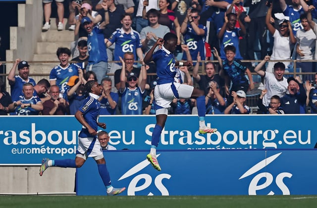 Soccer Football - Ligue 1 - RC Strasbourg v Paris St Germain - Stade de la Meinau, Strasbourg, France - May 3, 2025 RC Strasbourg's Mamadou Sarr celebrates their first goal, an own goal scored by Paris St Germain's Lucas Hernandez