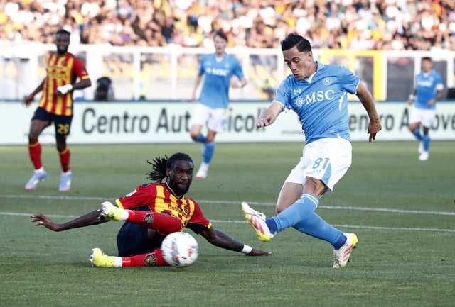 Soccer Football - Serie A - Lecce v Napoli - Stadio Via del mare, Lecce, Italy - May 3, 2025 Napoli's Giacomo Raspadori in action with Lecce's Kialonda Gaspar REUTERS/Alessandro Garofalo