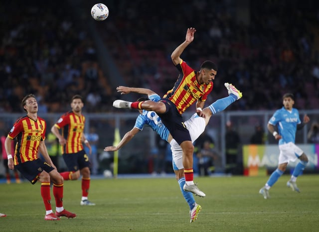 Soccer Football - Serie A - Lecce v Napoli - Stadio Via del mare, Lecce, Italy - May 3, 2025 Lecce's Danilo Veiga in action with Napoli's Giacomo Raspadori REUTERS/Alessandro Garofalo
