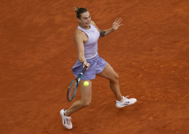 Tennis - Madrid Open - Park Manzanares, Madrid, Spain - May 3, 2025 Belarus' Aryna Sabalenka in action during the women's singles final against Coco Gauff of the U.S. REUTERS/Susana Vera