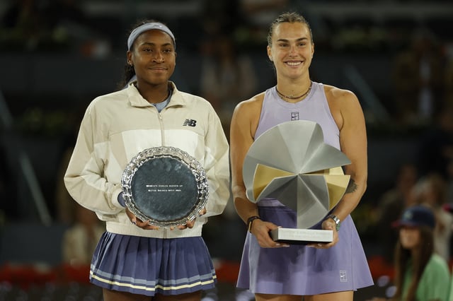 Tennis - Madrid Open - Park Manzanares, Madrid, Spain - May 3, 2025 Belarus' Aryna Sabalenka and Coco Gauff of the U.S. pose with the winners and runners up trophies after the women's singles final REUTERS/Juan Medina