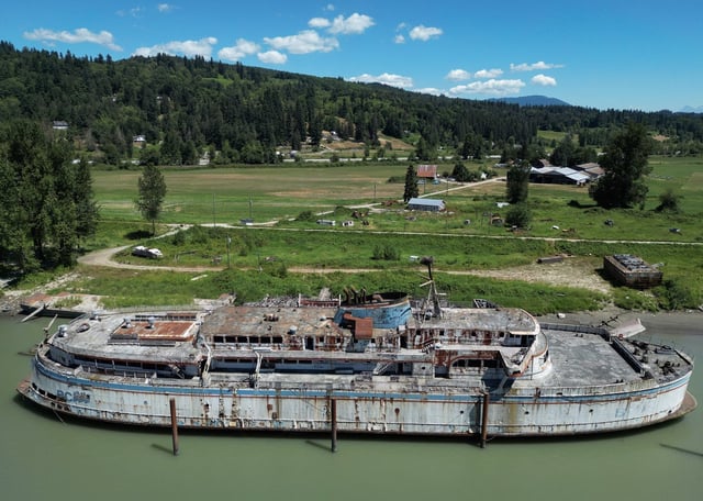 The retired BC Ferries vessel Queen of Sidney, which was in operation from 1960 to 2000, is seen moored on the Fraser River, in Mission, B.C., Tuesday, July 18, 2023. THE CANADIAN PRESS/Darryl Dyck