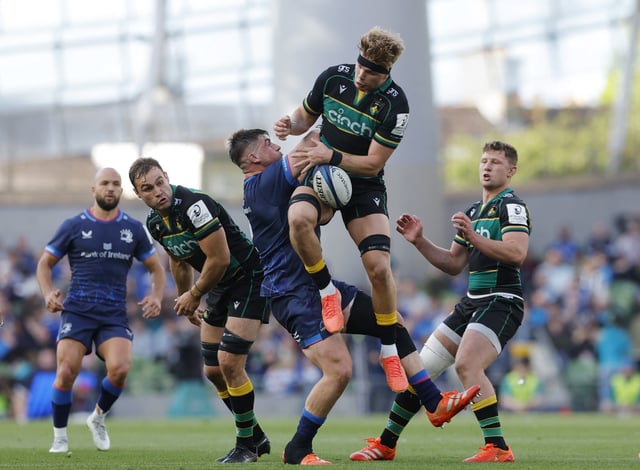 Rugby Union - European Champions Cup - Semi Final - Leinster v Northampton Saints - Aviva Stadium, Dublin, Ireland - May 3, 2025 Leinster's Dan Sheehan in action with Northampton Saints' Henry Pollock REUTERS/Clodagh Kilcoyne