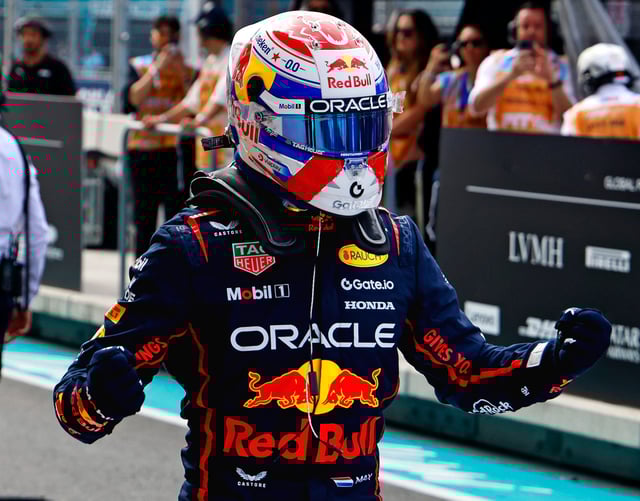 Red Bull driver Max Verstappen (1) celebrates after winning the pole during qualifying for the F1 Miami Grand Prix at Miami International Autodrome.