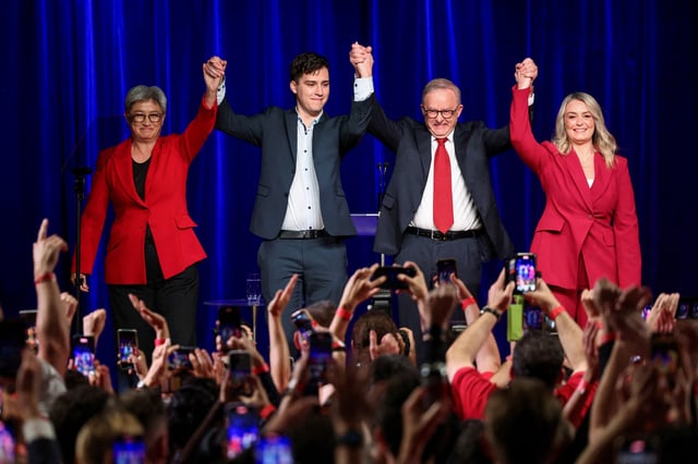 Australia's Prime Minister Anthony Albanese celebrates with his partner Jodie Haydon, his son Nathan Albanese and Minister for Foreign Affairs Penny Wong at a Labor party election night event, after local media projected the Labor Party's victory, on the day of the Australian federal election, in Sydney, Australia, May 3, 2025. REUTERS/Hollie Adams