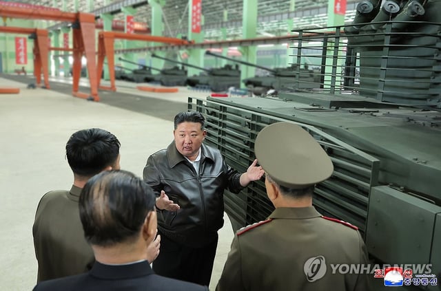 North Korean leader Kim Jong-un (C) inspects a tank factory in this undated photo released by the North's official Korean Central News Agency on May 4, 2025. The name and location of the factory was not disclosed. (For Use Only in the Republic of Korea. No Redistribution) (Yonhap)