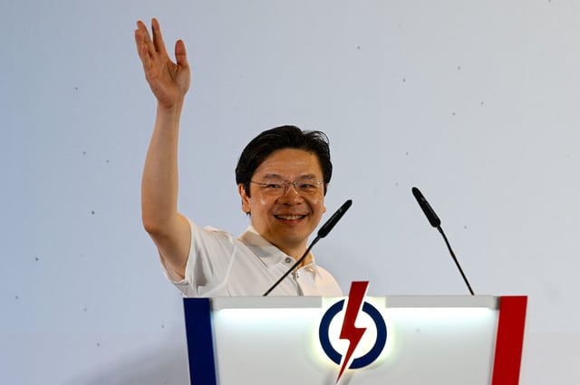 Singapore Prime Minister Lawrence Wong of the People's Action Party (PAP) celebrates at the party's gathering centre during the general election results, in Singapore on May 3, 2025. Singapore's ruling party headed for a crushing victory at general elections on May 3, sample counts showed, with voters giving Prime Minister Lawrence Wong the clear mandate he was seeking.