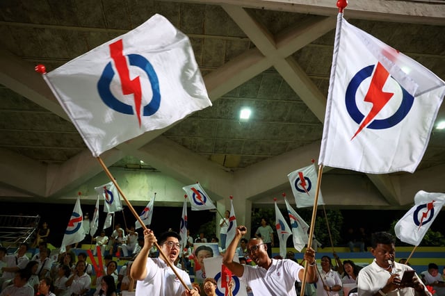 People's Action Party supporters gather at an assembly area to wait for results of the general election in Singapore, May 3, 2025. REUTERS/Edgar Su     TPX IMAGES OF THE DAY     