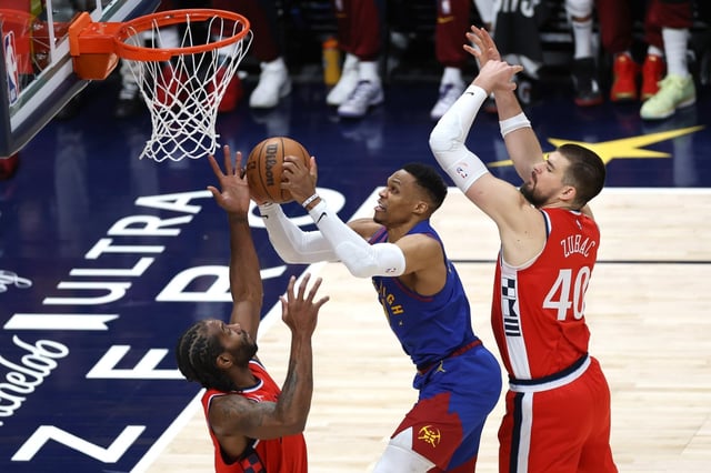 Denver Nuggets guard Russell Westbrook drives to the basket as the Clippers’ Kawhi Leonard, left, and Ivica Zubac defend during the third quarter of Game 7 of their first-round playoff series on Saturday night in Denver. The Clippers lost, 120-101, bringing their season to an end. (Photo by Matthew Stockman/Getty Images)