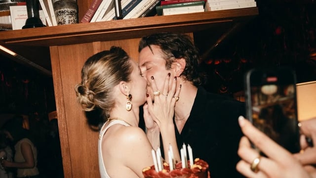 Gigi Hadid and Bradley Cooper seal it with a kiss during her birthday celebrations.
