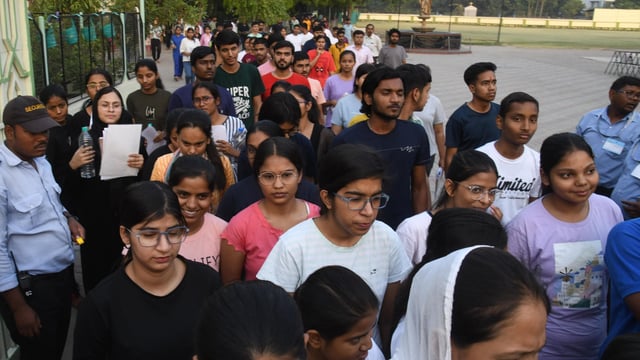 Candidates coming out after appearing in the NEET (UG) exam at an examination centre.
