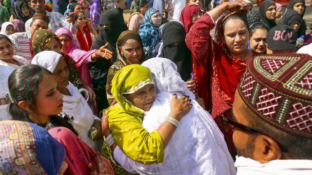 Pilgrims greet their family members and relatives as they leave for annual Hajj pilgrimage, at Sardar Vallabhbhai Patel International Airport, in Ahmedabad, Gujarat