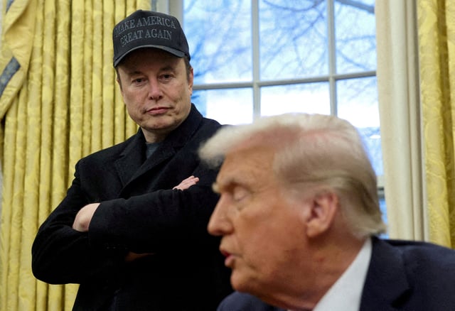 Elon Musk listens to President Donald Trump speak in the Oval Office of the White House on Feb. 11, 2025.