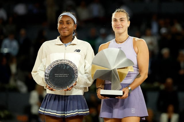 Belarus' Aryna Sabalenka, right, poses with her trophy after beating Coco Gauff in the final.