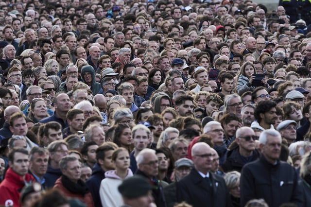 People attend a solemn annual national service to commemorate the war dead in Amsterdam, Netherlands, Sunday, May 4, 2025. (AP Photo/Peter Dejong)