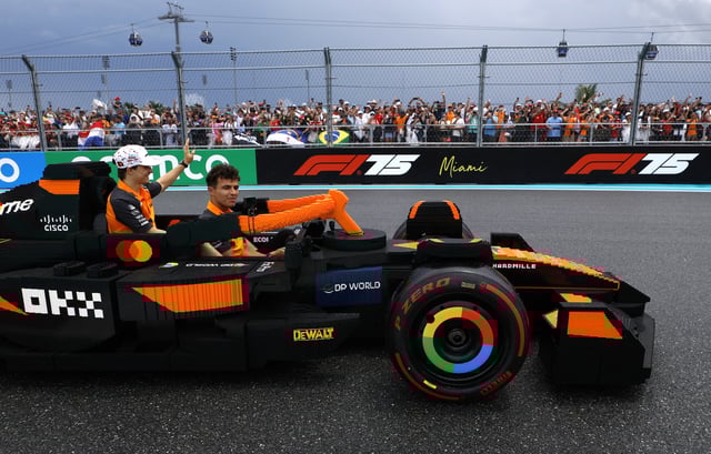 Formula One F1 - Miami Grand Prix - Miami International Autodrome, Miami, Florida, United States - May 4, 2025 McLaren's Lando Norris and Oscar Piastri in a full sized Lego replica F1 car during the drivers parade REUTERS/Marco Bello