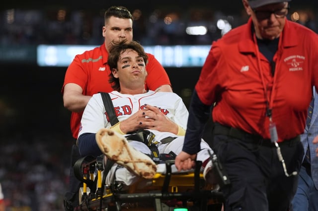 Boston Red Sox’s Triston Casas is transported off the field on a stretcher after an apparent injury during the second inning of a baseball game against the Minnesota Twins at Fenway Park, Friday, May 2, 2025, in Boston. (AP Photo/Charles Krupa)