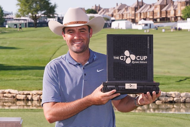 May 4, 2025; McKinney, Texas, USA; Scottie Scheffler poses with the winner's trophy during the final round of the THE CJ CUP Byron Nelson golf tournament. Scheffler won with a score of 31-under par for the tournament. Mandatory Credit: Raymond Carlin III-Imagn Images