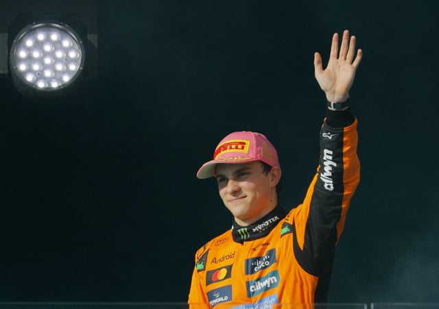 Formula One F1 - Miami Grand Prix - Miami International Autodrome, Miami, Florida, United States - May 4, 2025 McLaren's Oscar Piastri celebrates on the podium after winning the Miami Grand Prix REUTERS/Brian Snyder