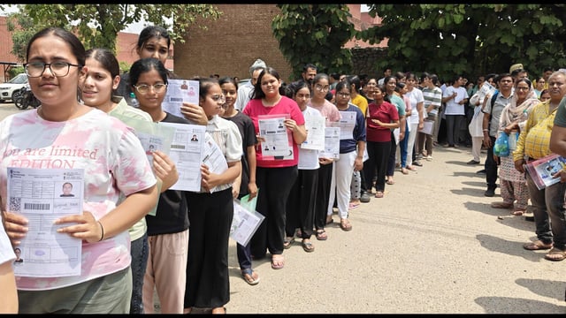Candidates lining up at an exam centre to appear for the National Eligibility cum Entrance Test in Ludhiana on Sunday. (Gurpreet Singh/HT)