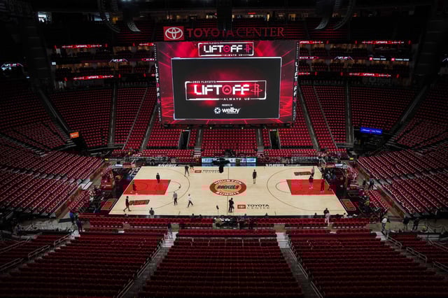 Houston Rockets players walk on the court while warming up before Game 7 of a first-round NBA playoff basketball series against the Golden State Warriors at Toyota Center in Houston, Sunday, May 4, 2025.