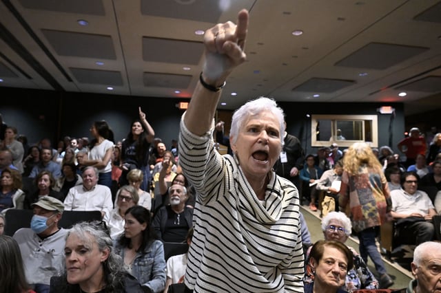 An audience member yells at U.S. Rep. Mike Lawler, R-N.Y., during a town hall, Sunday, May 4, 2025, in Somers, N.Y. (AP Photo/Jessica Hill)