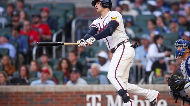 May 4, 2025; Atlanta, Georgia, USA; Atlanta Braves third baseman Austin Riley (27) hits a two-run home run against the Los Angeles Dodgers in the third inning at Truist Park. Mandatory Credit: Brett Davis-Imagn Images