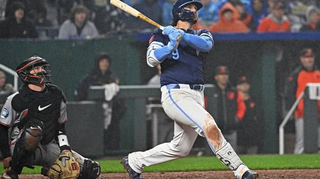 Kansas City Royals first baseman Vinnie Pasquantino (9) drives in three runs with a single in the eighth inning against the Baltimore Orioles at Kauffman Stadium.