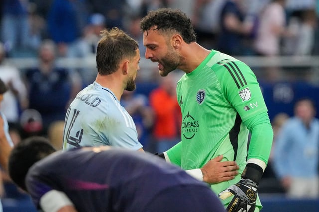 Sporting Kansas City goalkeeper John Pulskamp (right) celebrates with teammate Tim Leibold after the win over the LA Galaxy.