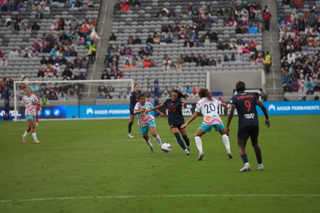 Bay FC defender Alyssa Malonson dribbles past San Diego Wave FC forward Delphine Cascarino during a match between the teams on May 4, 2025 at Snapdragon Stadium in San Diego. (Courtesy of Bay FC)