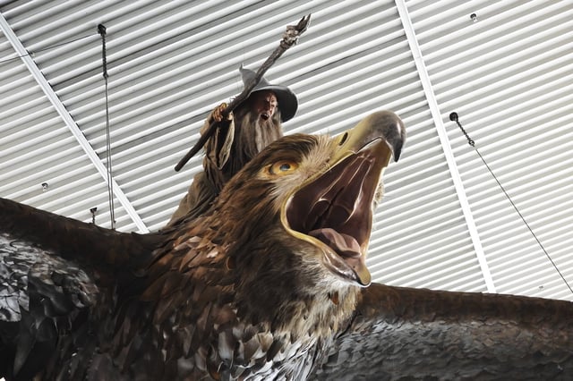 A sculpture of an eagle from the Hobbit films, ridden by the wizard Gandalf, hangs over the food court area of Wellington Airport, in Wellington, New Zealand, Monday, May 5, 2025. (AP Photo/Charlotte Graham-McLay)