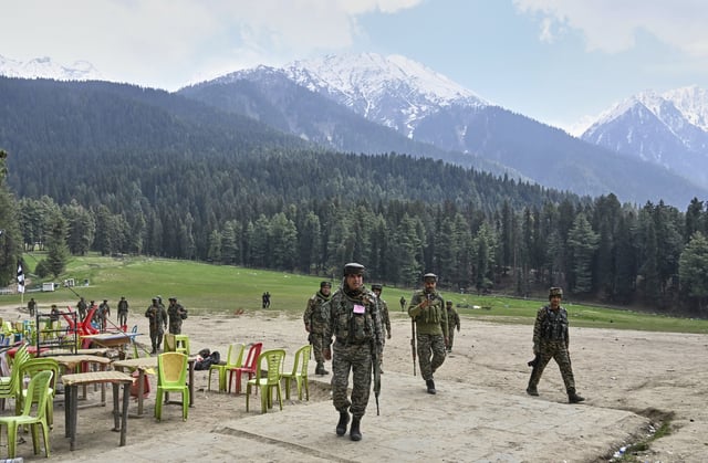 FILE - Indian security officers inspect the site a day after where militants indiscriminately opened fire at tourists in Pahalgam, Indian controlled Kashmir, Wednesday, April 23, 2025. (AP Photo, File)