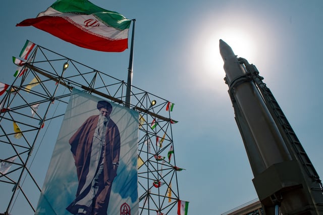 A big banner depicting Iran&#39;s Supreme Leader Ayatollah Ali Khamenei is placed next to a ballistic missile in Baharestan Square in Tehran, Iran, on September 26, 2024 on the sideline of an exhibition which marks the 44th anniversary of the start of Iran-Iraq war.