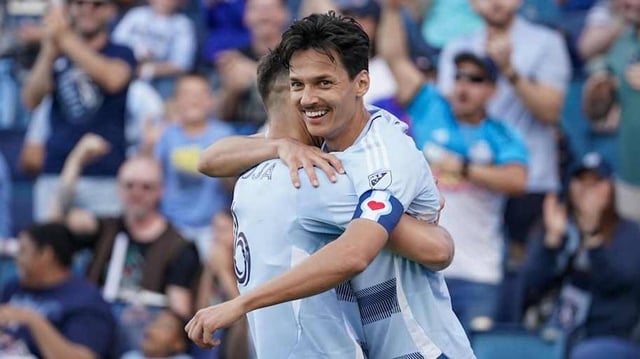 Daniel Salloi (left) celebrates with midfielder Nemanja Radoja after Maya Yoshida’s own goal