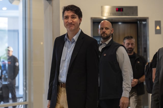 Canada Prime Minister Justin Trudeau walks through the lobby of the Delta Hotel by Marriott, Saturday, Nov. 30, 2024, in West Palm Beach, Fla. the day after meeting with Donald Trump at Mar-a-Lago.