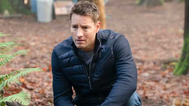Colter crouches down in the woods in Tracker