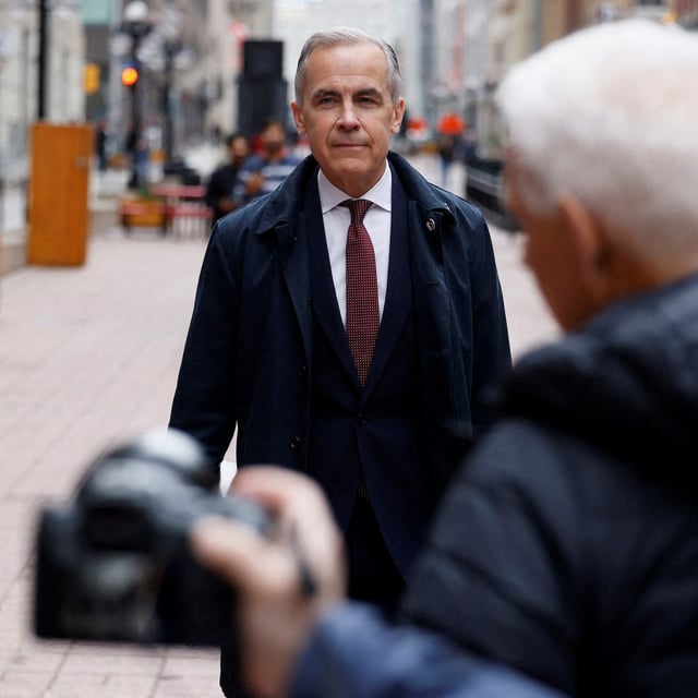 Prime Minister Mark Carney arrives to his first press conference since forming government, in Ottawa, on May 2.