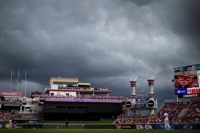 Storm clouds gather during a game between the Washington Nationals and the Cincinnati Reds in the fourth inning at Great American Ball Park on May 4, 2025, in Cincinnati.