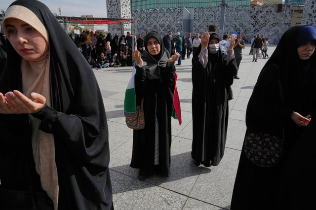 Demonstrators pray during their pro-Palestinian gathering in Tehran, Iran, Friday, May 2, 2025. (AP Photo/Vahid Salemi)