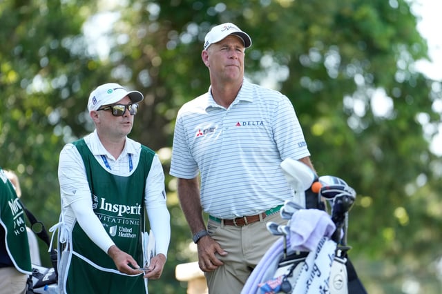 Stewart Cink of the United States stands with his caddie on the 18th tee during the third round of the Insperity Invitational 2025 at The Woodlands Golf Club on May 04, 2025 in The Woodlands, Texas.