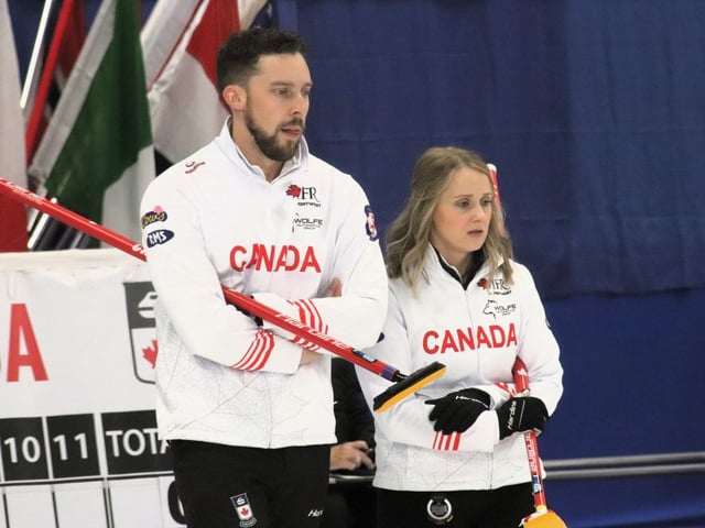 Brett Gallant, left, and Jocelyn Peterman discuss strategy during the 2025 world mixed doubles curling championship at Willie O'Ree Place in Fredericton last week. Gallant and Peterman have earned a mixed doubles berth for Team Canada in the 2026 Winter Olympics in Italy.