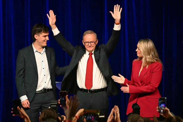 Australia's Prime Minister Anthony Albanese celebrates with his partner Jodie Haydon and son Nathan Albanese after winning the general election at the Labor Party election night event in Sydney on May 3, 2025. 