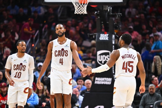 CLEVELAND, OHIO - MARCH 30: Evan Mobley #4 of the Cleveland Cavaliers celebrates with Donovan Mitchell #45 during the third quarter against the LA Clippers during the third quarter at Rocket Arena on March 30, 2025 in Cleveland, Ohio.