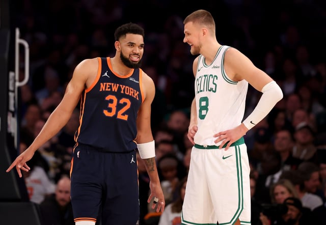 NEW YORK, NEW YORK - APRIL 08: Karl-Anthony Towns #32 of the New York Knicks and Kristaps Porzingis #8 of the Boston Celtics talk in the first half at Madison Square Garden on April 08, 2025 in New York City. NOTE TO USER: User expressly acknowledges and agrees that, by downloading and or using this photograph, User is consenting to the terms and conditions of the Getty Images License Agreement. (Photo by Elsa/Getty Images)