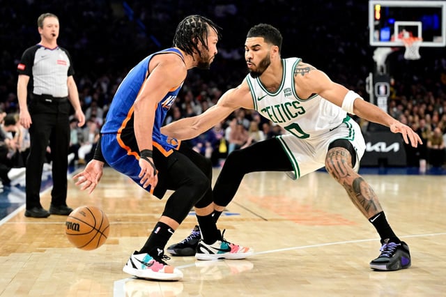 NEW YORK, NEW YORK - FEBRUARY 24:  Jalen Brunson #11 of the New York Knicks is defended by Jayson Tatum #0 of the Boston Celtics during the second half at Madison Square Garden on February 24, 2024 in New York City. NOTE TO USER: User expressly acknowledges and agrees that, by downloading and or using this photograph, User is consenting to the terms and conditions of the Getty Images License Agreement. (Photo by Steven Ryan/Getty Images)