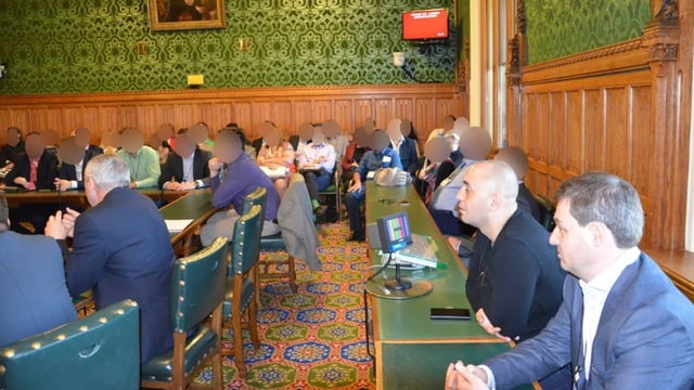 Orlin Roussev, front right, and Biser Dzhambazov, seated next to him, in the parliamentary committee room