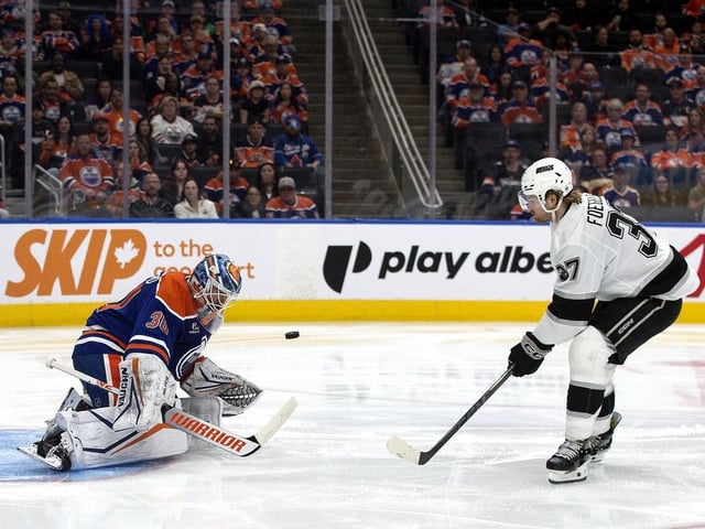 Edmonton Oilers' goalie Calvin Pickard (30) stops the Los Angeles Kings' Warren Foegele (37) on a breakaway during second period NHL playoff action, in Edmonton on Thursday, May 1, 2025. 