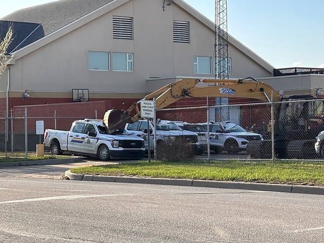An Alberta man has been charged after a stolen trackhoe was used to destroy several RCMP police vehicles and dump boulders at a local detachment as shown in this police handout photo.  THE CANADIAN PRESS/HO-RCMP ** MANDATORY CREDIT**