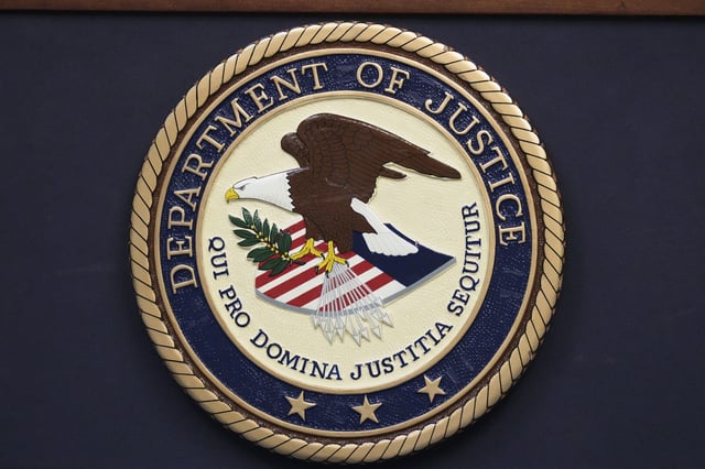 FILE - The Department of Justice seal is seen during a news conference Thursday, Dec. 5, 2024, in Memphis, Tenn. (AP Photo/George Walker IV, File)